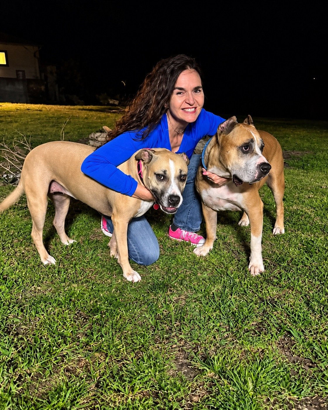 Susan Taylor with two dogs, owner of Hearts With Peace pet care serving Bryan and College Station